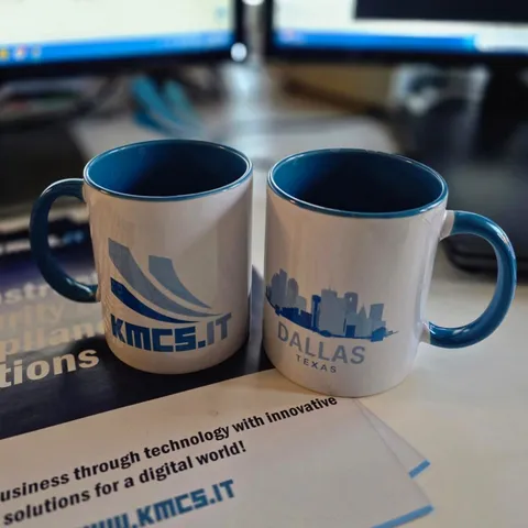 KMCS.it and Dallas, Texas branded mugs at the KMCS IT office