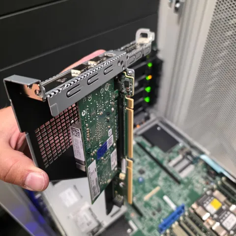 Network interface card being installed in a server PCIe riser